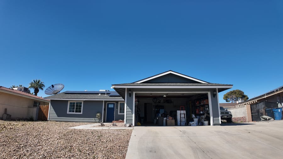 Single-story ranch home with solar panels and wide driveway, sold by Park Place Realty, Las Vegas